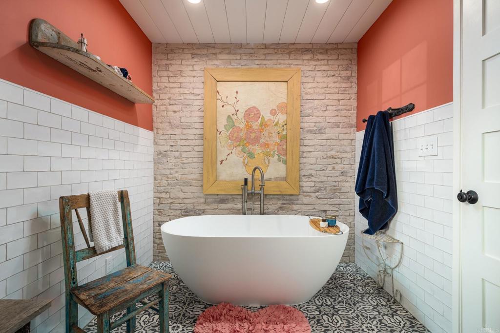 5757 San Elijo Avenue Rancho Santa Fe, CA 92067 - Photo 19 of 23 a bathroom with a bathtub and shower