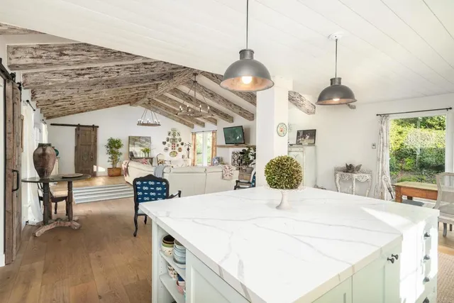 a kitchen with stainless steel appliances a refrigerator and a stove