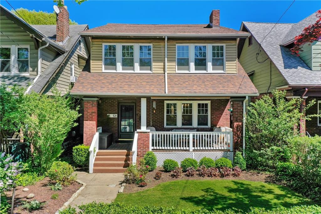 531 Peebles Street Pittsburgh, PA 15221 - Photo 1 of 30 a front view of a house with a garden