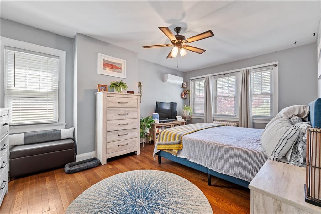 531 Peebles Street Pittsburgh, PA 15221 - Photo 18 of 30 a bedroom with a bed and furniture