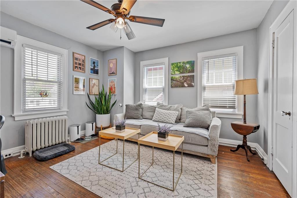531 Peebles Street Pittsburgh, PA 15221 - Photo 20 of 30 a living room with furniture and wooden floor