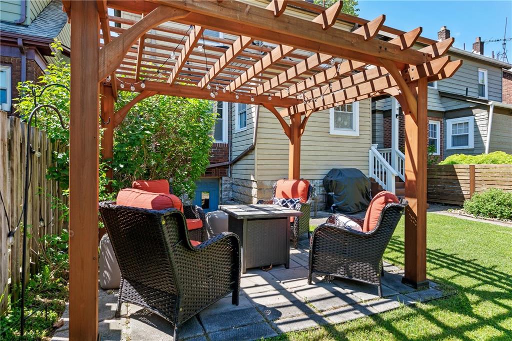 531 Peebles Street Pittsburgh, PA 15221 - Photo 25 of 30 a view of a chair and fire pit in the patio in front of a house