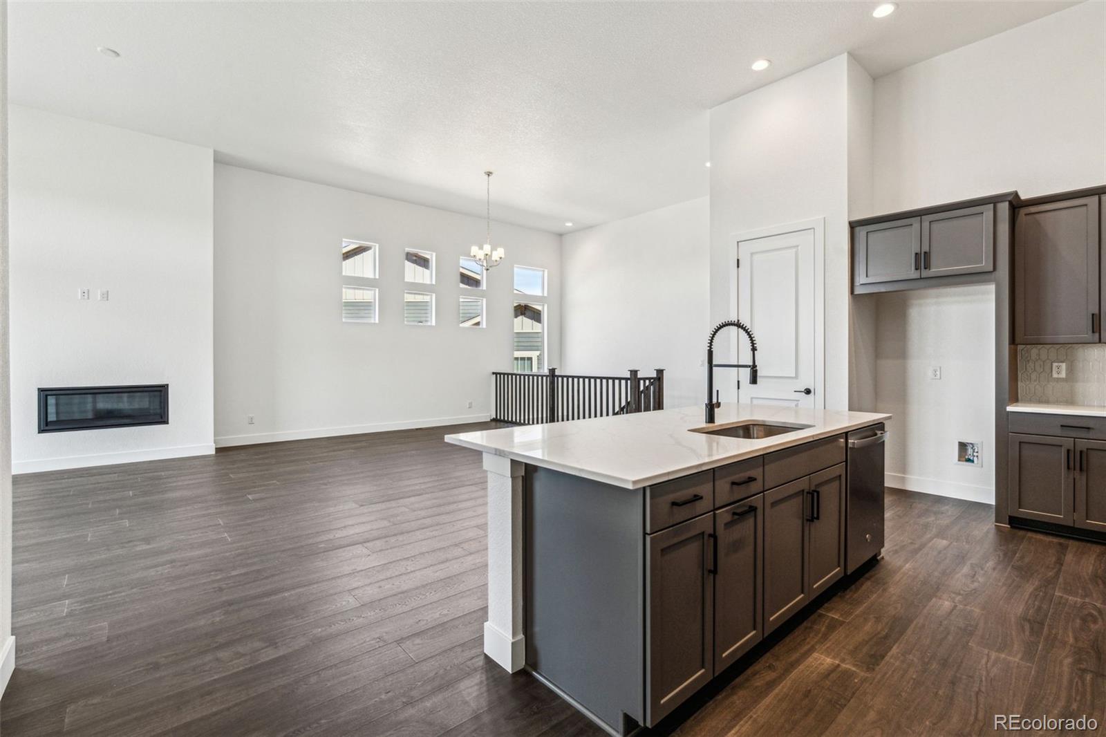 3884 Freestone Point Castle Rock, CO 80108 - Photo 15 of 34 a kitchen with a stove and a refrigerator