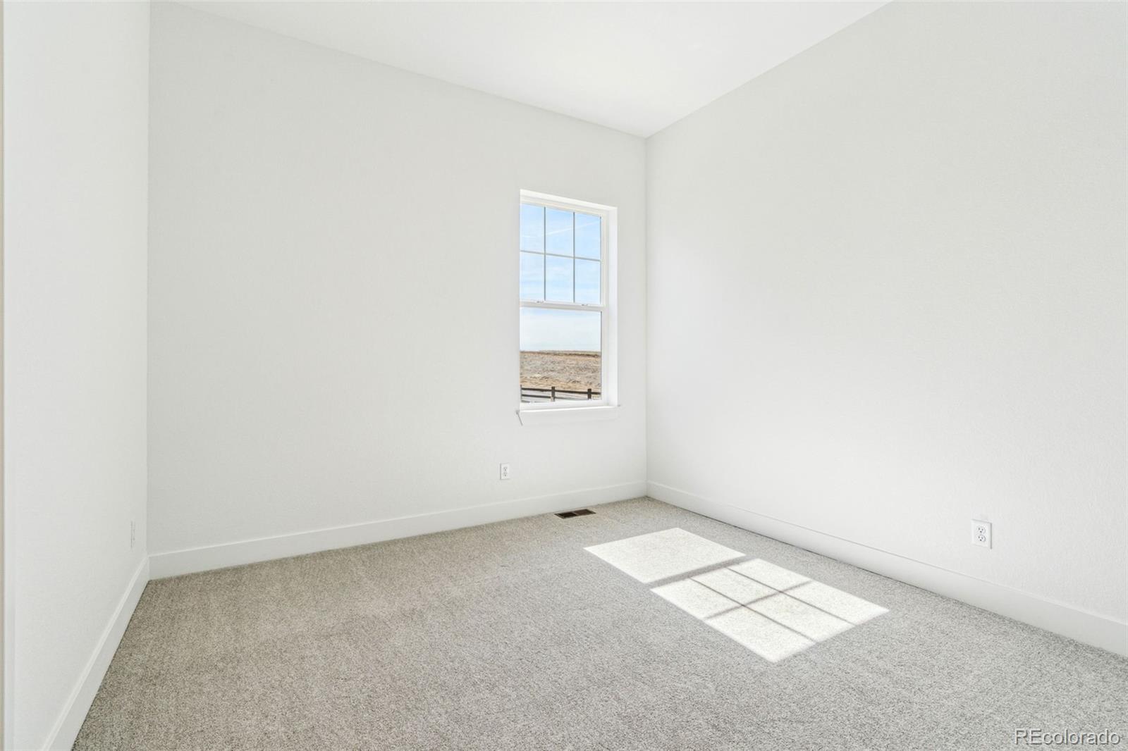 3884 Freestone Point Castle Rock, CO 80108 - Photo 21 of 34 an empty room with a window