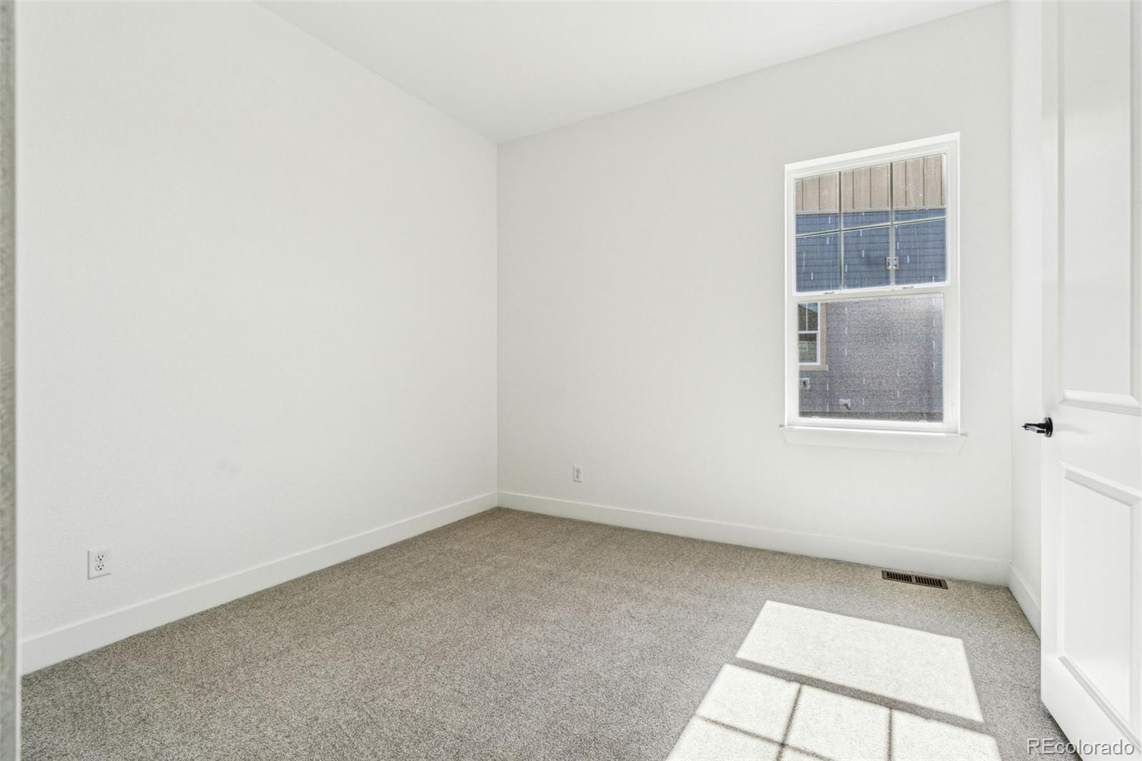3884 Freestone Point Castle Rock, CO 80108 - Photo 23 of 34 an empty room with a window