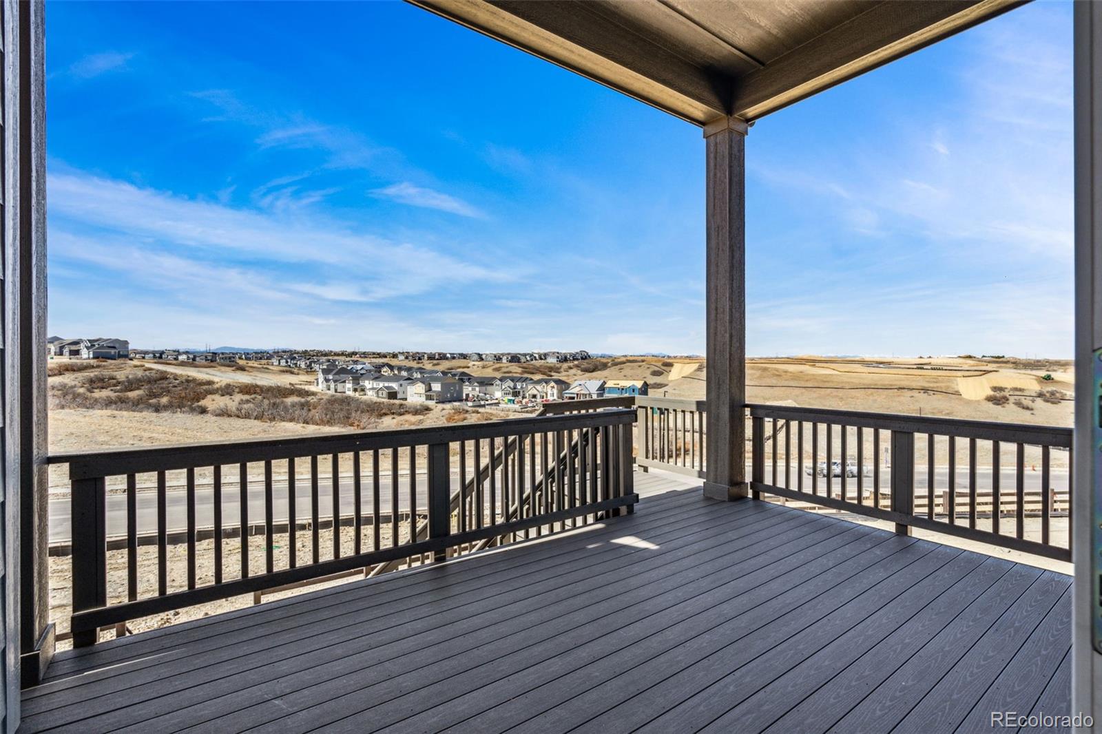 3884 Freestone Point Castle Rock, CO 80108 - Photo 25 of 34 a view of a balcony with wooden floor