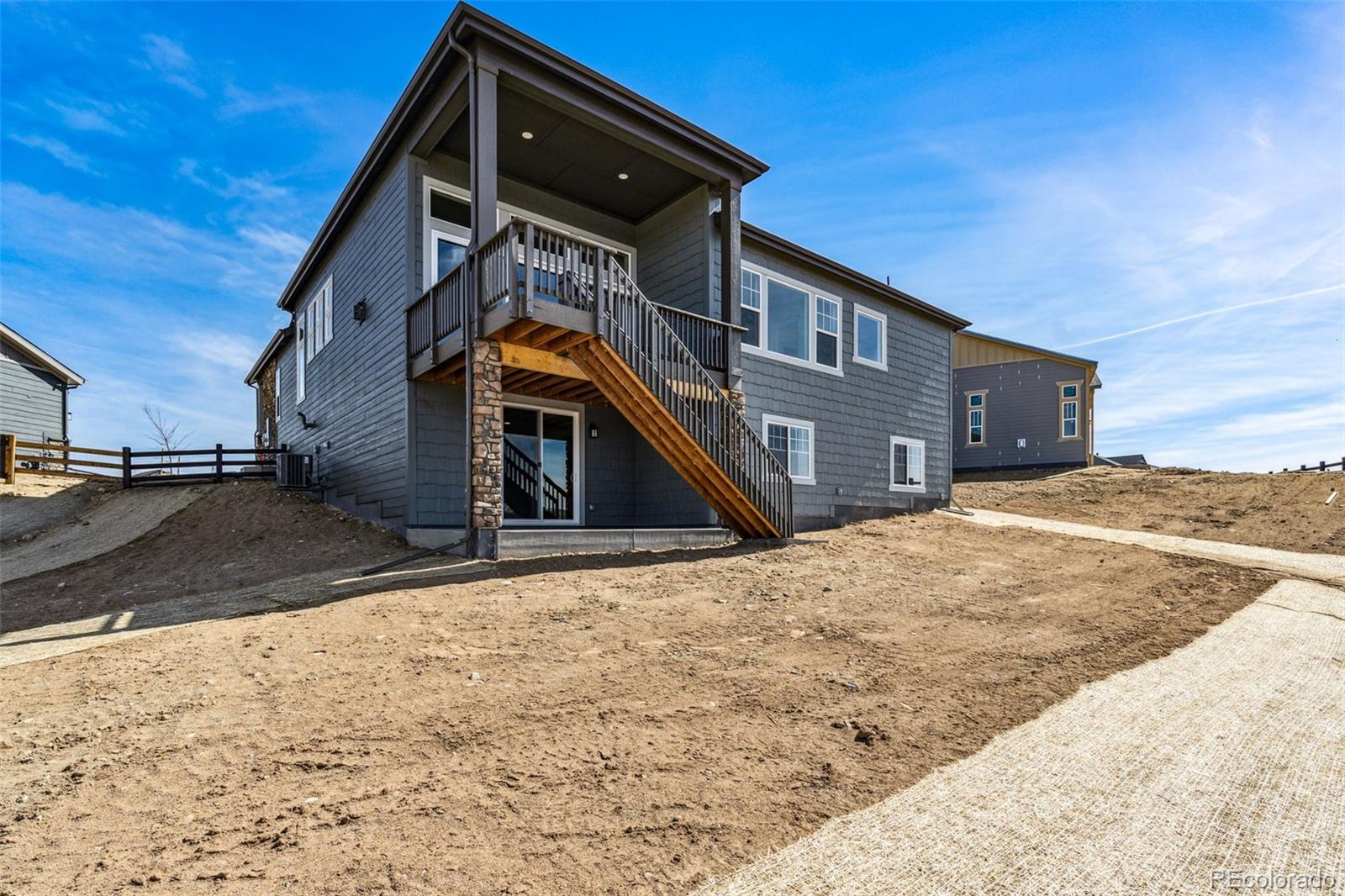 3884 Freestone Point Castle Rock, CO 80108 - Photo 27 of 34 a view of a house with a snow on the road