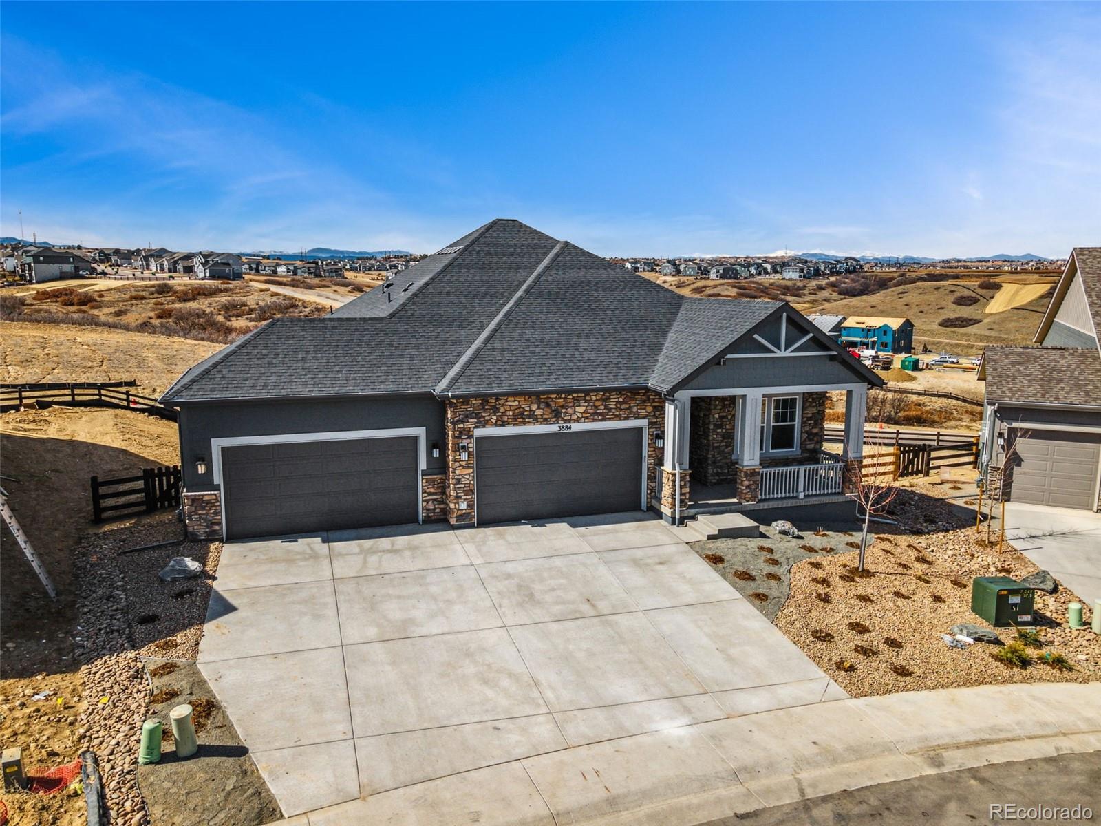 3884 Freestone Point Castle Rock, CO 80108 - Photo 5 of 34 a front view of a house with a yard