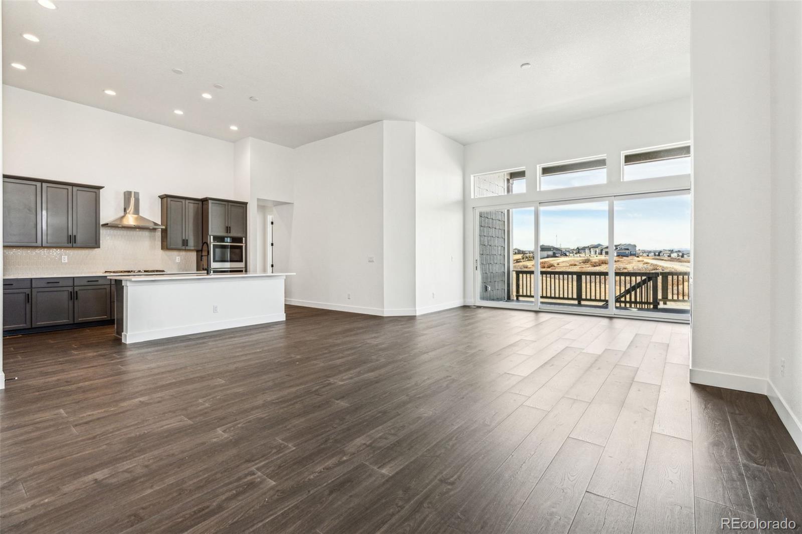 3884 Freestone Point Castle Rock, CO 80108 - Photo 10 of 34 a view of kitchen with granite countertop cabinets and refrigerator