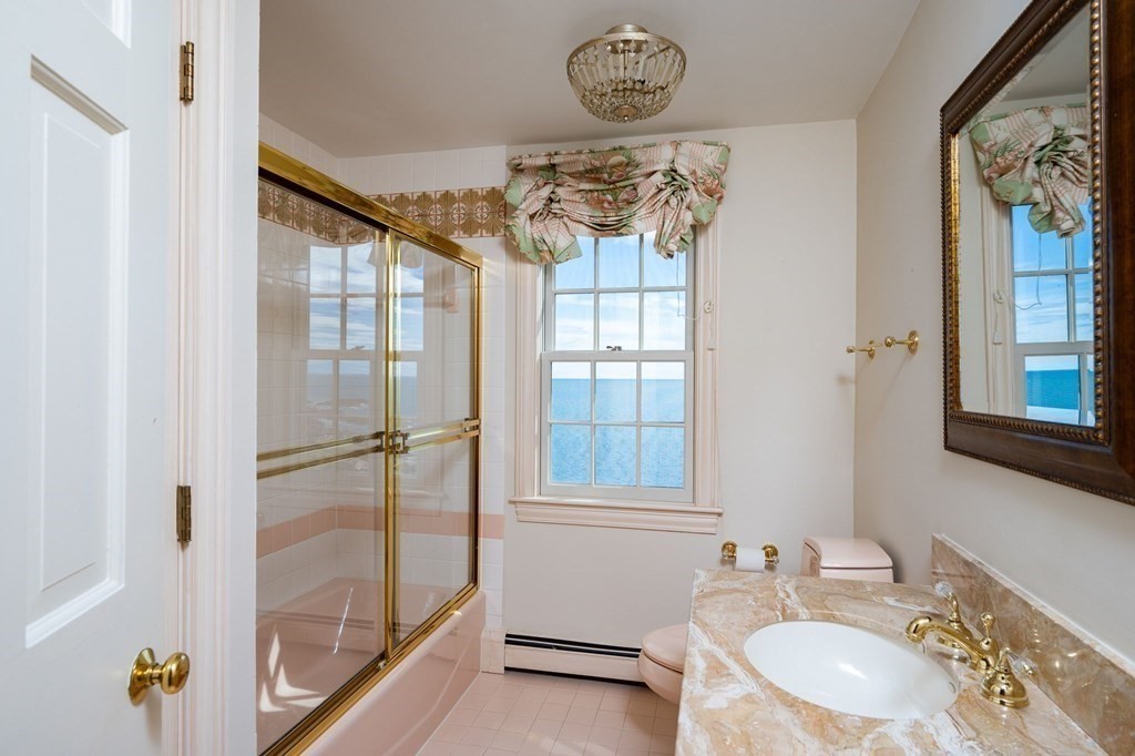 475 Jerusalem Road Cohasset, MA 02025 - Photo 18 of 41 a bathroom with a granite countertop sink a mirror and a shower