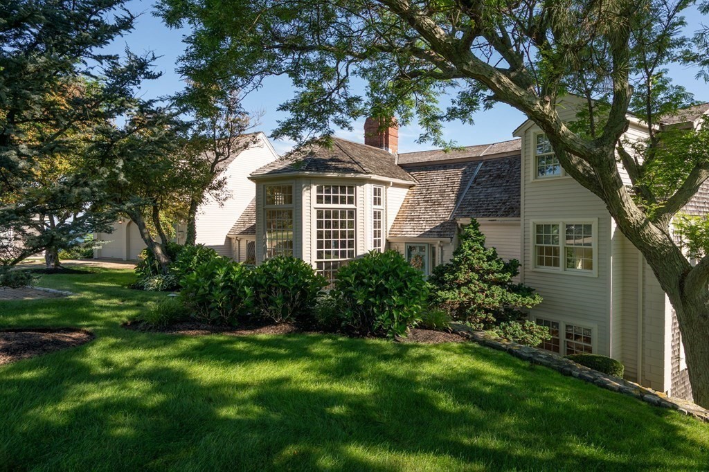 475 Jerusalem Road Cohasset, MA 02025 - Photo 2 of 41 a front view of a house with a garden