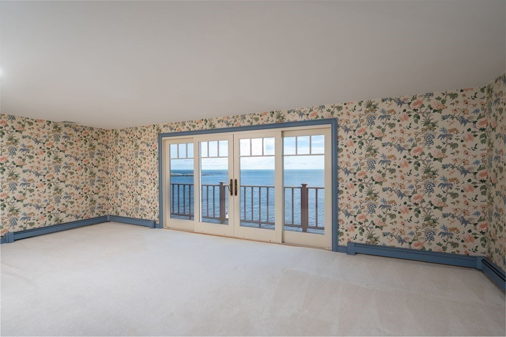 475 Jerusalem Road Cohasset, MA 02025 - Photo 23 of 41 a view of an empty room with a balcony