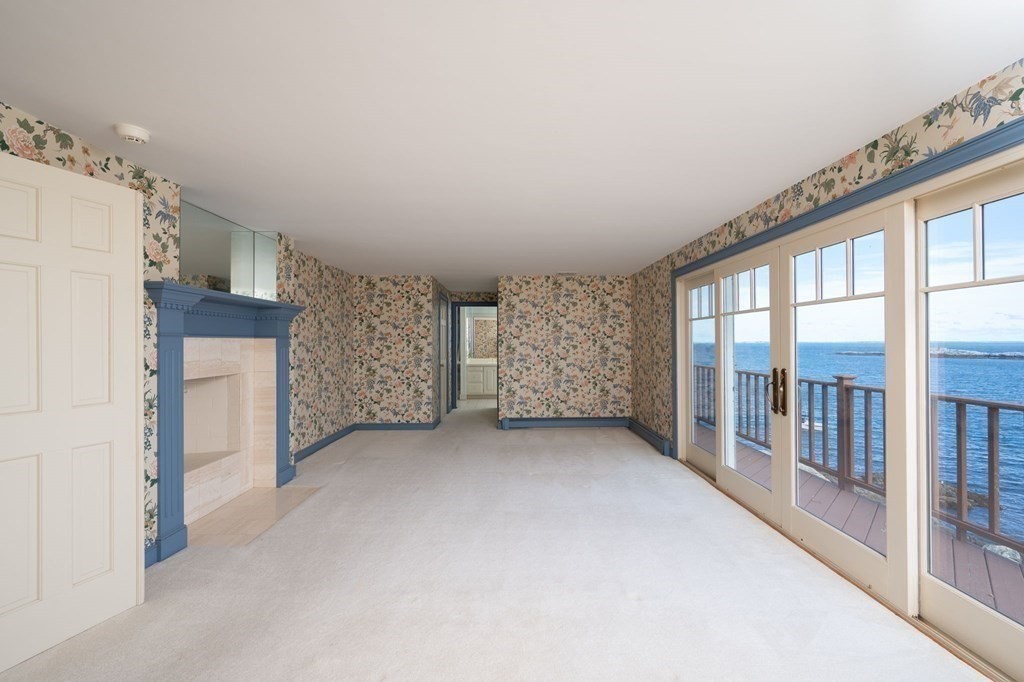 475 Jerusalem Road Cohasset, MA 02025 - Photo 24 of 41 a view of an empty room with a fireplace