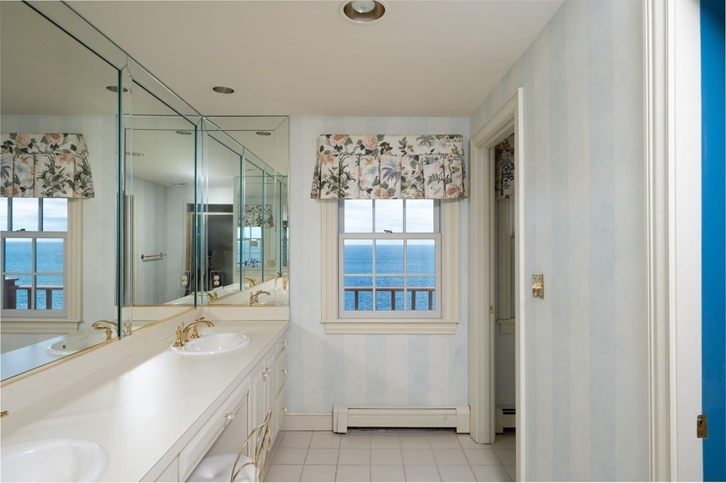 475 Jerusalem Road Cohasset, MA 02025 - Photo 26 of 41 a spacious bathroom with a granite countertop tub sink and mirror