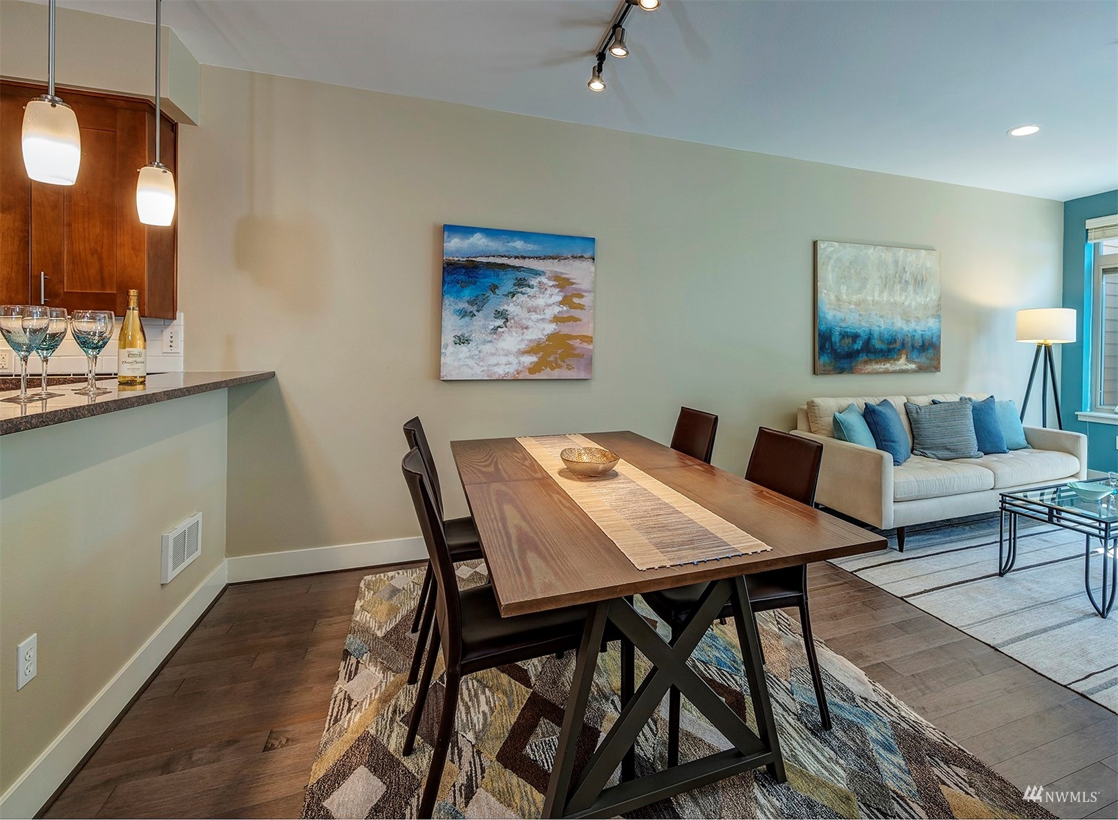51 Pine Street, Unit 202 Edmonds, WA 98020 - Photo 12 of 30 a view of a dining room with furniture and wooden floor