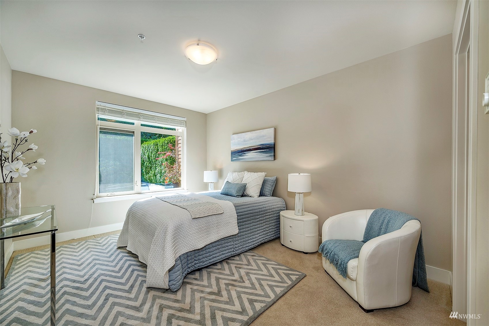 51 Pine Street, Unit 202 Edmonds, WA 98020 - Photo 14 of 30 a room with a bed and a couch