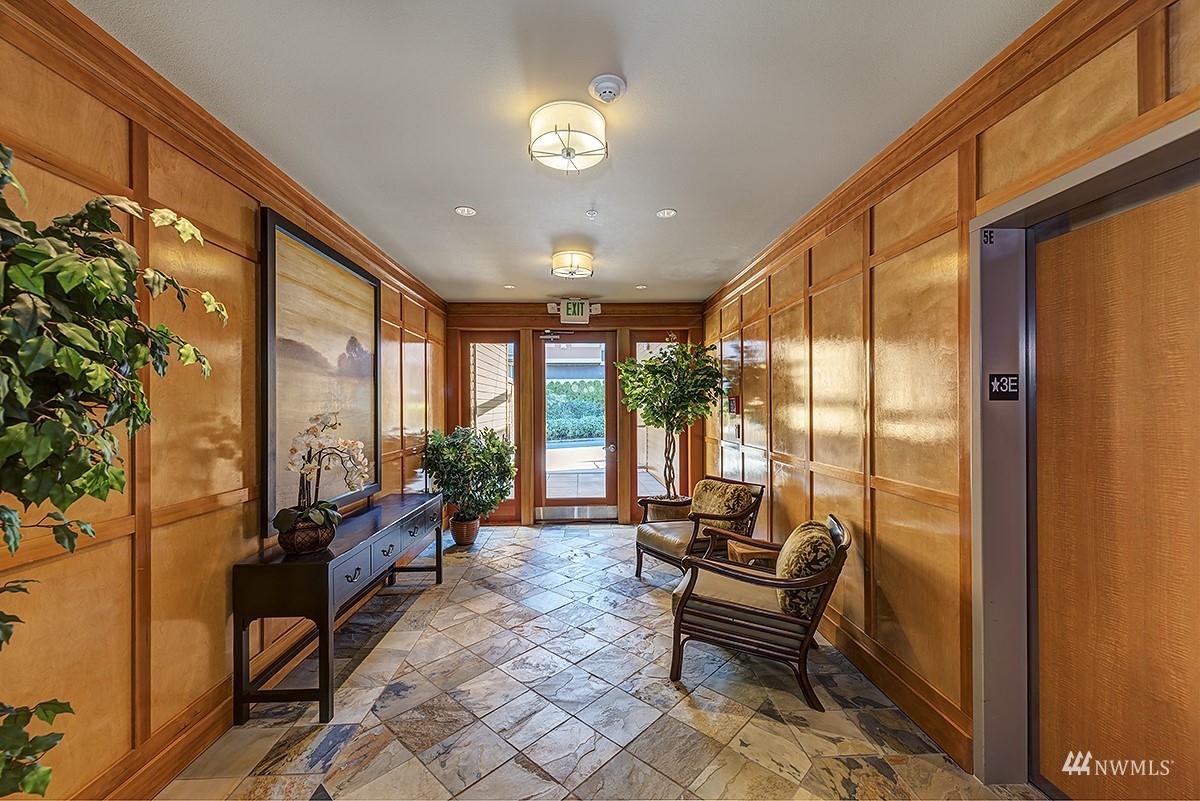 51 Pine Street, Unit 202 Edmonds, WA 98020 - Photo 4 of 30 a living room with furniture and a floor to ceiling window