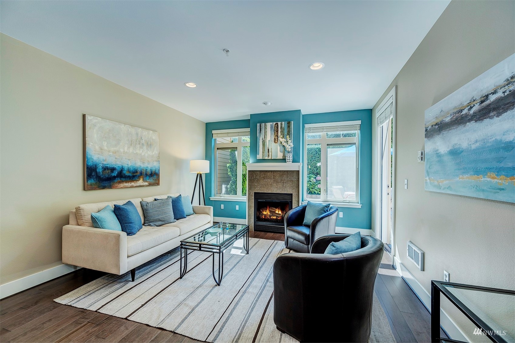 51 Pine Street, Unit 202 Edmonds, WA 98020 - Photo 6 of 30 a living room with furniture and a fireplace