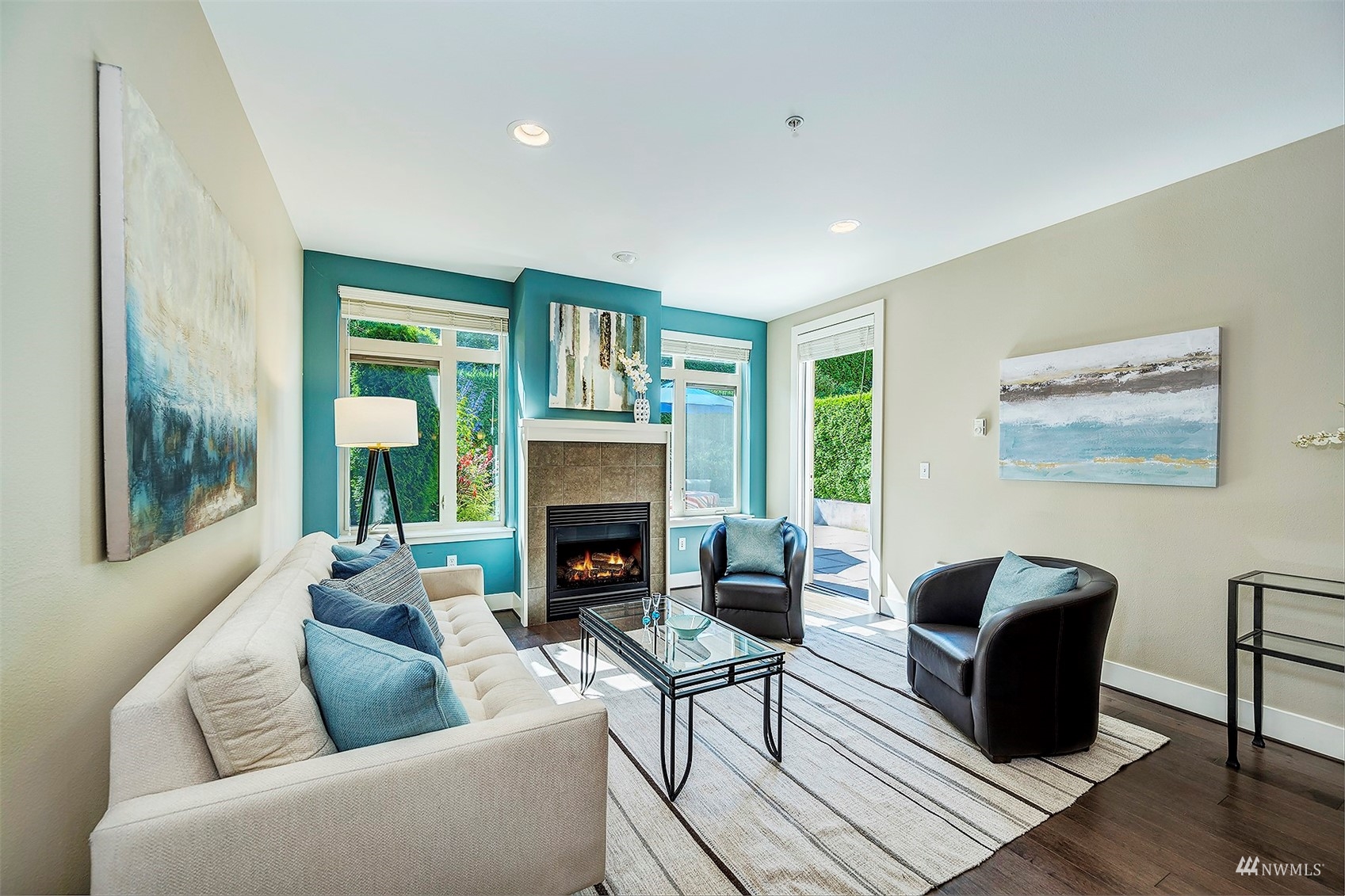51 Pine Street, Unit 202 Edmonds, WA 98020 - Photo 7 of 30 a living room with furniture and a fireplace