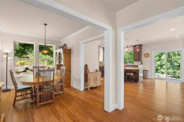 a view of a dining room with furniture window and wooden floor