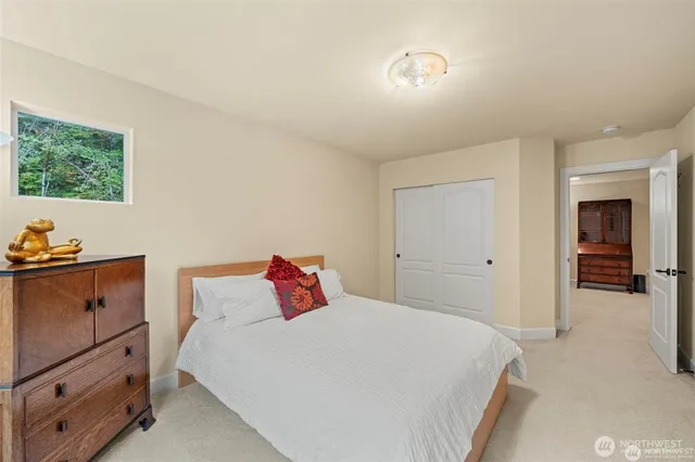 a bedroom with a bed and a television