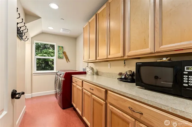 a kitchen with a refrigerator and a window