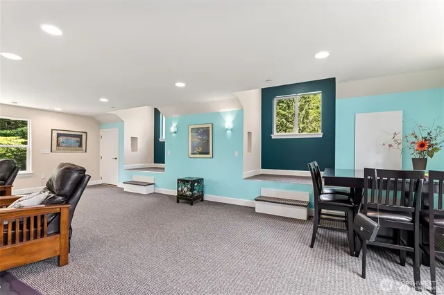 a livingroom with furniture and lounge chair