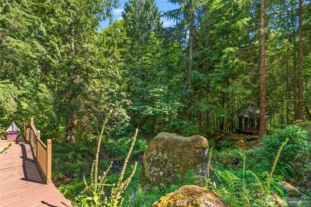 a backyard of a house with lots of green space