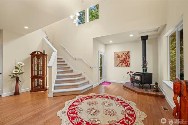 a bedroom with furniture and a wooden floor