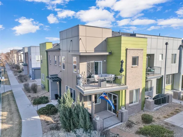 a view of a patio with table and chairs and potted plants