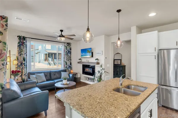 a living room with furniture and a fireplace