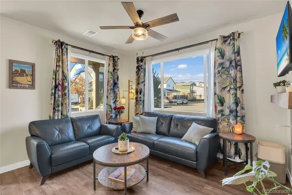 a living room with furniture and a large window