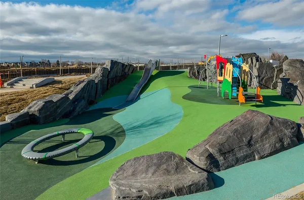 a view of a play ground with swimming pool