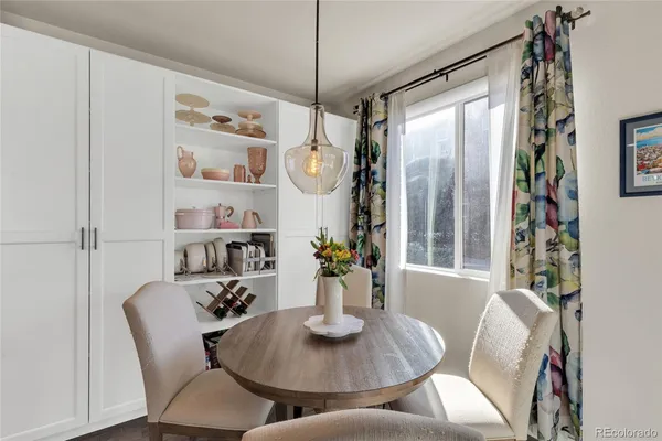 a view of a dining room with furniture window and wooden floor
