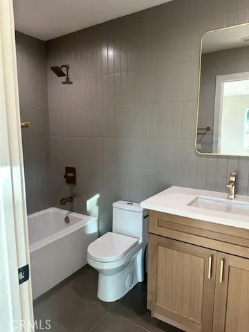 a bathroom with a sink a toilet and bathtub