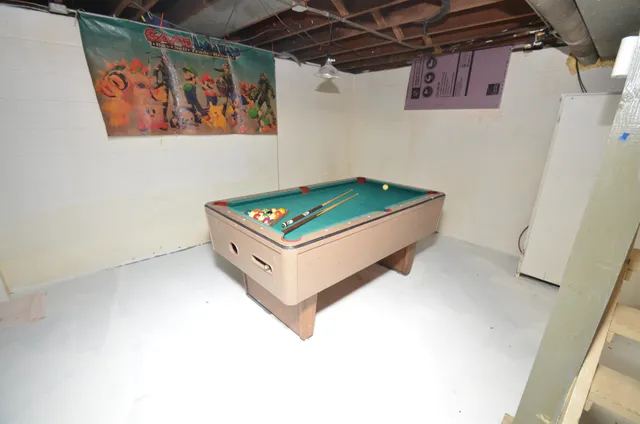 a view of a storage room with water heater and racks
