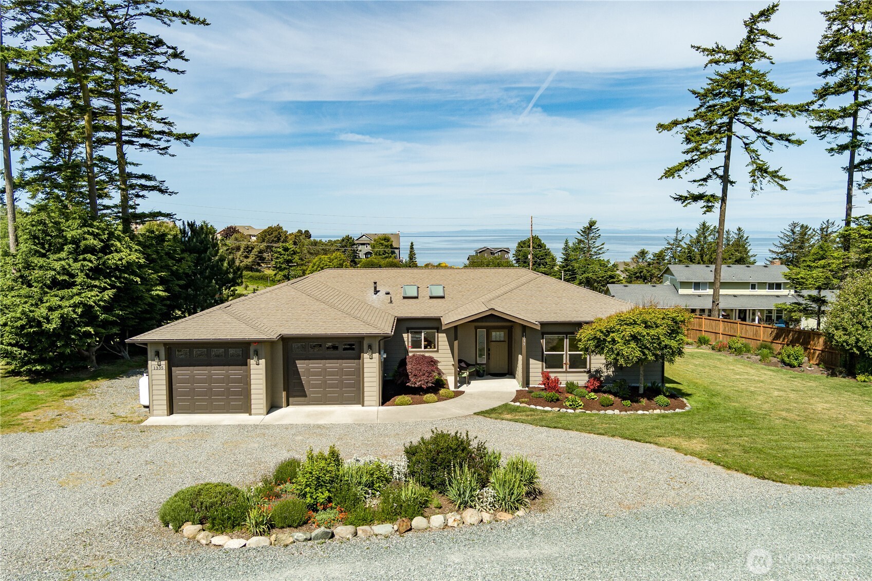 1335 Crestline Terrace Oak Harbor, WA 98277 - Photo 2 of 39 a front view of a house with garden