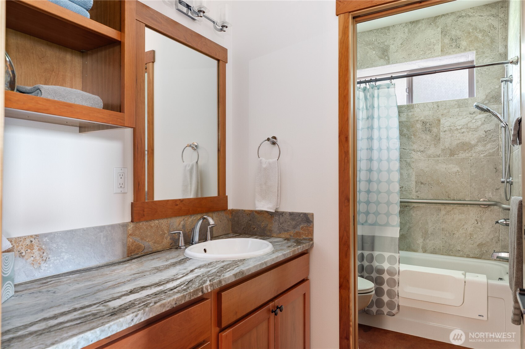 1335 Crestline Terrace Oak Harbor, WA 98277 - Photo 28 of 39 a bathroom with a granite countertop sink a mirror and shower