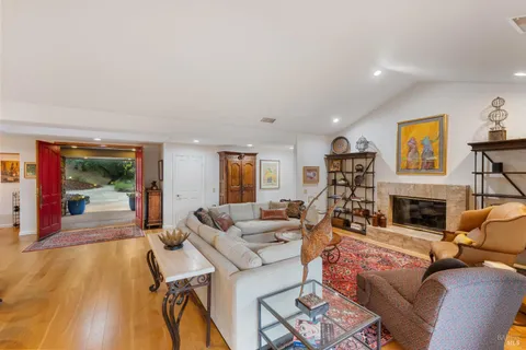 a living room with furniture fireplace and a flat screen tv