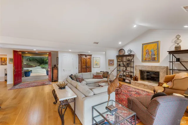 a living room with furniture fireplace and a flat screen tv