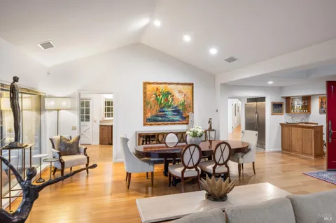 a living room with fireplace furniture and a flat screen tv
