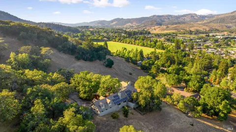 a view of a town with mountains in the background