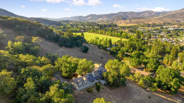 a view of a town with mountains in the background