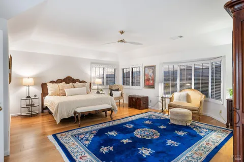 a living room with furniture a rug and a fireplace