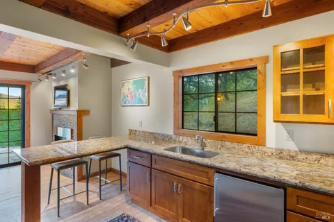 a kitchen with a sink cabinets and window