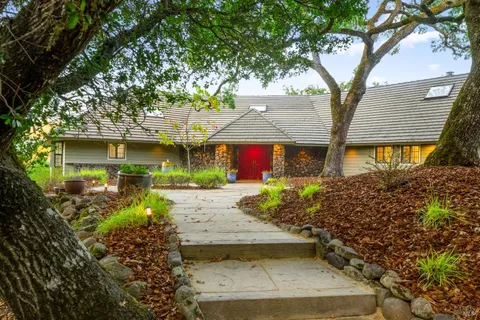 front view of a house with a garden