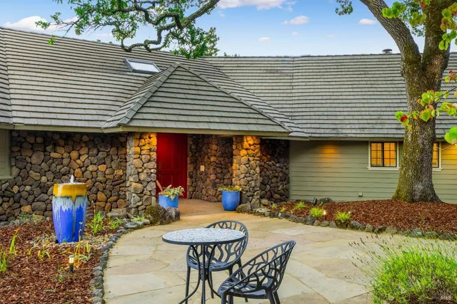 a front view of a house with patio