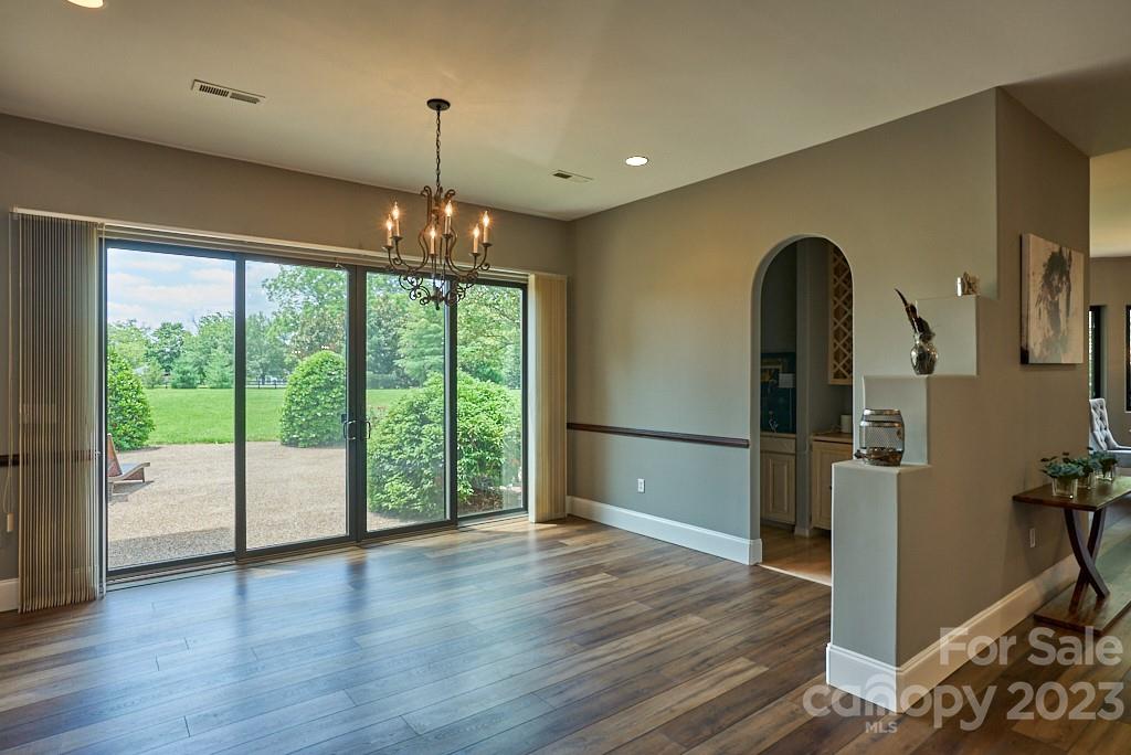 290 Stable Gate Drive Campobello, SC 29322 - Photo 17 of 39 a view of empty room with wooden floor and outdoor view