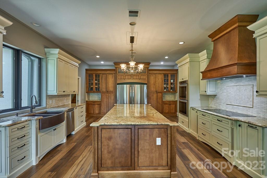290 Stable Gate Drive Campobello, SC 29322 - Photo 18 of 39 a kitchen with kitchen island granite countertop a stove and a sink