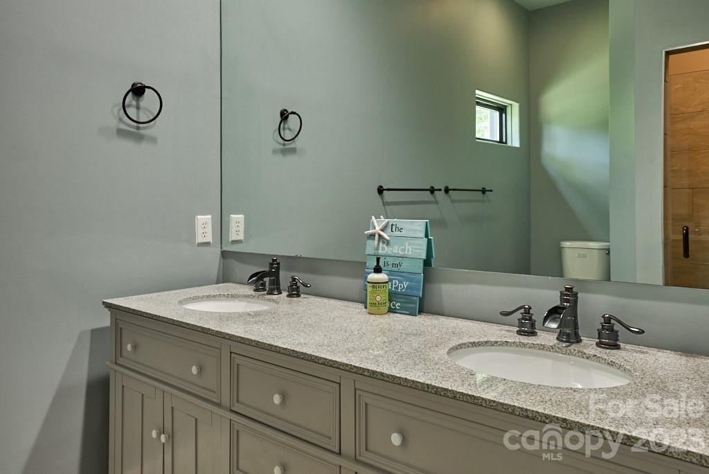 290 Stable Gate Drive Campobello, SC 29322 - Photo 31 of 39 a bathroom with a granite countertop sink and a mirror